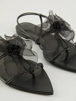 Sandalen mit Blumenverzierung Schwarz