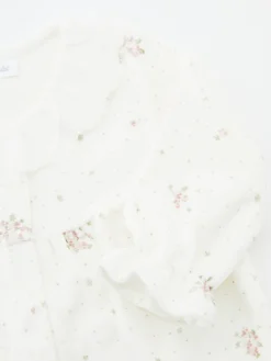 Strampler mit Blumenmuster Weiß